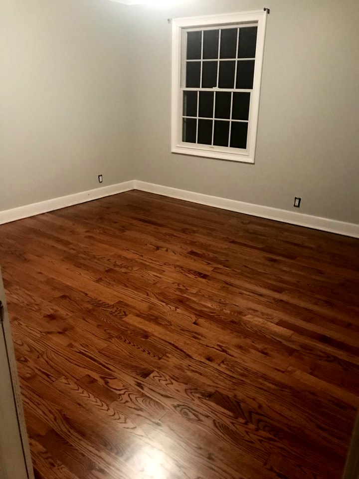 Finished room with refinished oak flooring