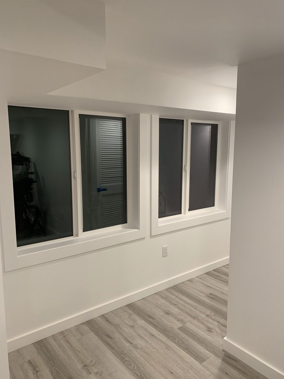 Three windows with newly installed wood casing and sills